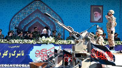 Iran's President Hassan Rouhani, center, reviews a military parade during the 37th anniversary of Iraq's 1980 invasion of Iran in September 2017, in front of the shrine of the late revolutionary founder, Ayatollah Khomeini, just outside Tehran, Iran. Ebrahim Noroozi/ AP Photo