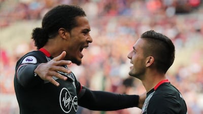 Southampton’s Dusan Tadic celebrates scoring their second goal with Virgil van Dijk. Eddie Keogh / Reuters