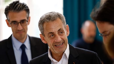 France's former president Nicolas Sarkozy, next to Mayor of Paris' 16th district Jeremy Redler. AFP