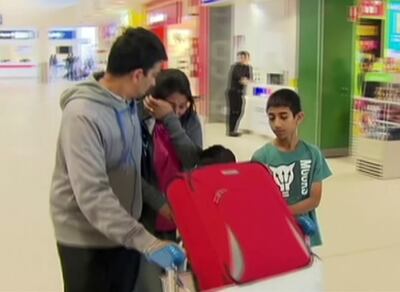 This image made from video shows a crying passenger at an airport in Perth, Australia after the Indonesia AirAsia flight from Australia to the holiday island of Bali returned safely to the airport. Channel 7 via AP