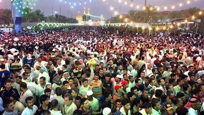 Thousands of Iraqi Shiite pilgrims gather near the Imam Abbas shrine in Karbala to commemorate the birth of Imam Mahdi, revered by Shiites. Mohammad Sawaf / AFP Photo