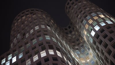 The partially illuminated Berlin headquarters of Signa after it announced it will file for insolvency. The European property developer has stakes in New York's Chrysler Building, and luxury department stores KaDeWe in Berlin and Selfridges in London. EPA