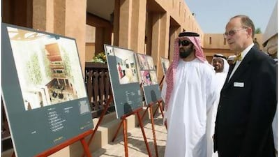 Sheikh Tahnoon bin Zayed and David Printy, the president of Oasis Hospital, yesterday look at redevelopment designs that will see the number of beds quadruple at the facility.