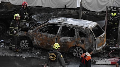 Firefighters and rescue workers at the site. AFP