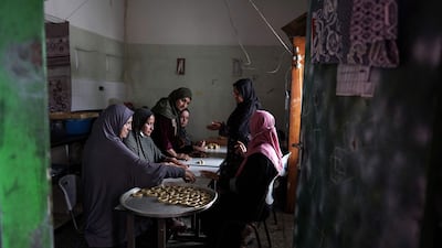 Palestinian women in central Gaza prepare traditional cookies for Eid Al Fitr, which marks the end of Ramadan. AFP