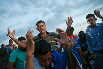 Central American migrants, part of a caravan trying to reach the US, pray in Ciudad Hidalgo, Mexico October 22, 2018. Reuters