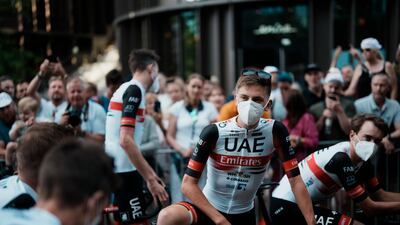 Tadej Pogacar, centre, and other UAE Team Emirates riders wait for the team's presentation in Copenhagen, Denmark. AP