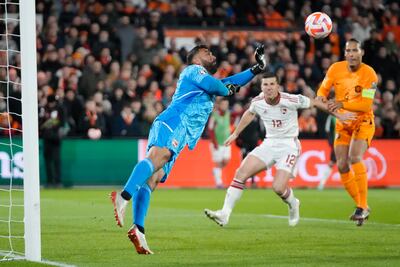 Gibraltar's goalkeeper Dayle Coleing saves before Netherlands' Virgil van Dijk, right, can score. AP Photo