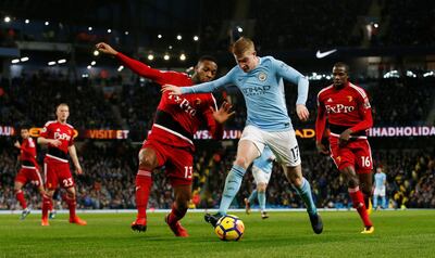 Manchester City's Kevin de Bruyne in action with Watford's Molla Wague. Andrew Yates / Reuters