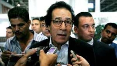 Farouk Hosni, centre, the Egyptian culture minister, speaks to journalists in Cairo yesterday. His defeat is a disappointment for many in the Middle East. Khaled Desouki / AFP. Below, Irina Bokova arrives in Paris after the Unesco election.