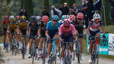 Overall race leader Egan Bernal wearing the pink jersey on a gravel section during Stage 11. AFP