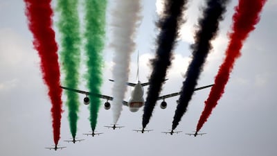 Lower fuel charges are likely to bring a 'huge boost' to the bottom line for Emirates. Above, an Airbus A380 with the Al Fursan demonstration team at the Dubai Air Show. Ali Haider / EPA