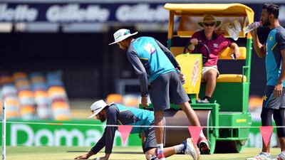 Pakistan's captain Azhar Ali inspects the pitch prior to the first Test. AFP