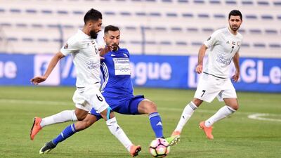 Al Nasr's Joan Omari (6) vies for possession with Al Dhafra's Khalid Al Zaabi. Courtesy Arshad Khan