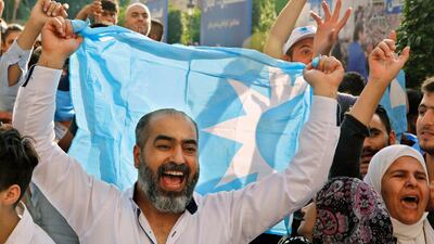 Supporters of Lebanese Prime Minister Saad Hariri celebrate his bloc winning 21 seats in the parliamentary elections, paving the way for him to be the next premier, at his house in Beirut, Friday, May 11, 2018. Bilal Hussein / AP Photo