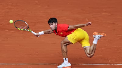 Carlos Alcaraz of Spain plays a forehand against Tommy Paul of the USA. Getty Images