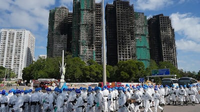 Police officers from the Disaster Victim Identification Unit arrive to retrieve bodies. AFP