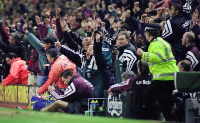 Liverpool manager Roy Evans, arms aloft, and coach Ronnie Moran, behind Evans, celebrate Stan Collymore's stoppage time winner. Getty Images