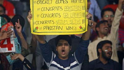 Spectators at Gaddafi cricket in Lahore on Sunday. EPA