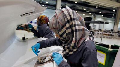 A woman technician at STRATA, a composite aerostructures manufacturing plant in Al Ain. Jumana El Heloueh / Reuters