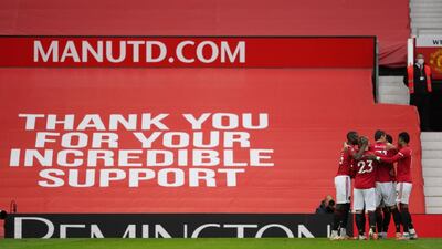 Manchester United players celebrate with Bruno Fernandes. Reuters