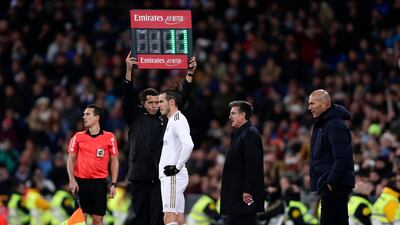 Bale prepares to come on as a sub, a move greeted with whistles and jeers from the crowd. AP