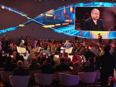 Masayoshi Son, chief executive of SoftBank, left, takes part in a discussion at the Future Investment Initiative Institute in Riyadh. Salim Essaid / The National