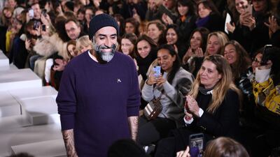 Lebanese fashion designer Rabih Kayrouz acknowledges the audience at the end of his show. AFP