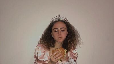 The student opted for some 1980s-style prom wear, plus tiara, to enjoy some fast food, writing: 'Fried chicken joes burgers are really good." Instagram