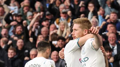 De Bruyne celebrates with teammates after scoring the first. EPA