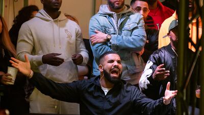 An animated Drake watches the action. EPA