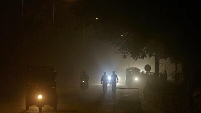 People and vehicles pass through the busy Lal Chowk area of Srinagar, India. Farooq Khan / EPA