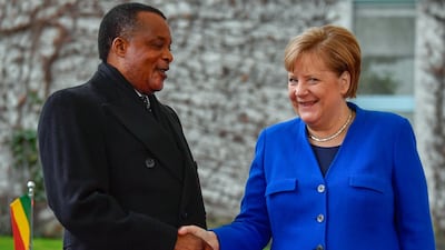 German Chancellor Angela Merkel greets Congolese President Denis Sassou Nguesso upon his arrival to attend the peace summit on Libya at the Chancellery in Berlin. AFP