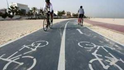 Cyclists on Jumeirah Beach in Dubai.