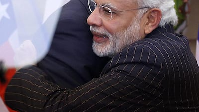 A suit worn by Indian prime minster Narendra Modi has drawn scorn on social media after enlarged photos show his own name is printed across the outfit. EPA