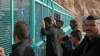 People gather at the site of the collapse as rescue workers search for survivors. AFP