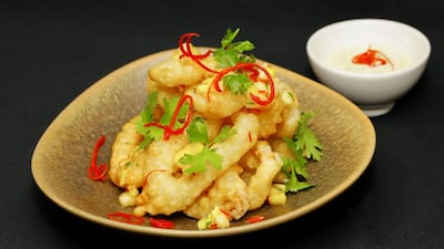 Wasabi marinated calamari in tempura with mango chilli and pineapple salsa. Victor Besa for The National