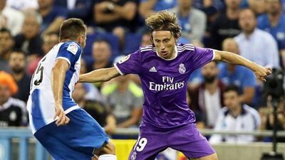 Espanyol defender David Lopez, left, in action against Real Madrid’s Luka Modric. Alberto Estevez / EPA