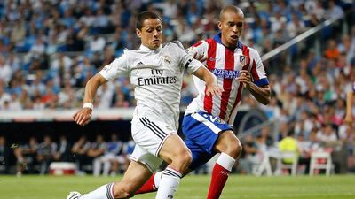 Javier Hernandez, left, of Real Madrid competes for the ball with Joao Miranda of Atletico Madrid during the Spanish Primera Liga match at Estadio Santiago Bernabeu on September 13, 2014, in Madrid, Spain. Angel Martinez / Getty Images