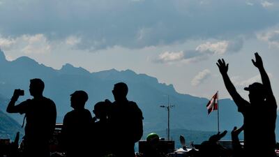 Spectators wait at the start line prior to the 10th stage of the Tour de France between Annecy and Le Grand-Bornand. Philippe Lopez / AFP