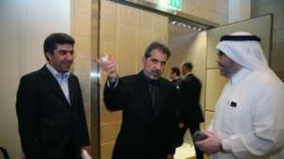 The outgoing Iranian ambassador, Dr Hamid Reza Asefi, centre, talks with Mohammed al Habeeb, right, the president of Al Habeeb Group of Companies, and Dr Mohammed Reza Esparvarin, the chief executive of the Iran Trade and Industry Consultation Centre, at a hotel in Dubai yesterday.