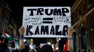 A Pro-Palestinian protester holds up a sign outside the venue of the debate between Donald Trump and Kamala Harris in Philadelphia. Reuters