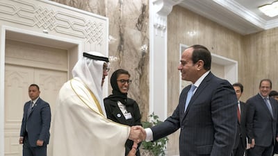 Abdel Fattah El Sisi, President of Egypt (R) greets Abdul Rahman Mohamed Al Owais, UAE Minister of Health and Prevention (L), at Heliopolis Palace, during an official visit. They are seen with Noura Mohamed Al Kaabi, UAE Minister of Culture and Knowledge Development (2nd L). Mohamed Al Hammadi / Crown Prince Court - Abu Dhabi