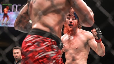 Shara Magomedov, red gloves, fights Mark-Andre Barriault, blue gloves, during the middleweight bout of UFC Fight Night: Whittaker vs de Ridder at Etihad Arena, Abu Dhabi. Victor Besa / The National