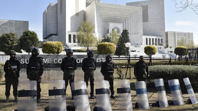 Pakistani security officials stand guard outside the Supreme Court in Islamabad, Pakistan. EPA