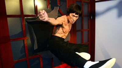 A wax figure of martial arts legend and actor Bruce Lee is shown busting through a door in a classic action pose during an unveiling ceremony at the Madame Tussauds Hollywood Museum in Hollywood, California, USA, September 24, 2014. Bruce Lee’s wax likeness will be on permanent display in the action heroes room. EPA