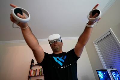 Pastor DJ Soto, the lead pastor of VR Church, delivers a sermon in his home on January 23, in Fredericksburg, Virginia, US. Soto sings, preaches and performs digital baptisms in the metaverse to a growing congregation of avatars. AP