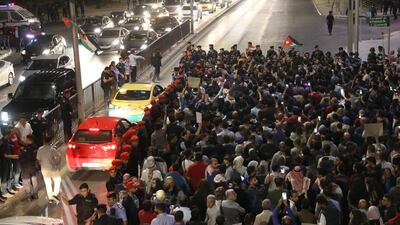 Demonstrators are blocked by security forces. Andre Pain / EPA