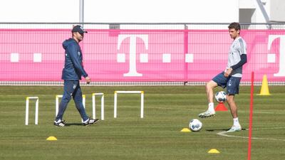 Bayern manager Hansi Flick, left, and Thomas Mueller during a training session as the team returned to training for the first time since the Bundesliga campaign was halted by the coronavirus pandemic. EPA