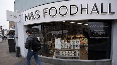 A man walks past a branch of Marks and Spencer supermarket in west London. AFP